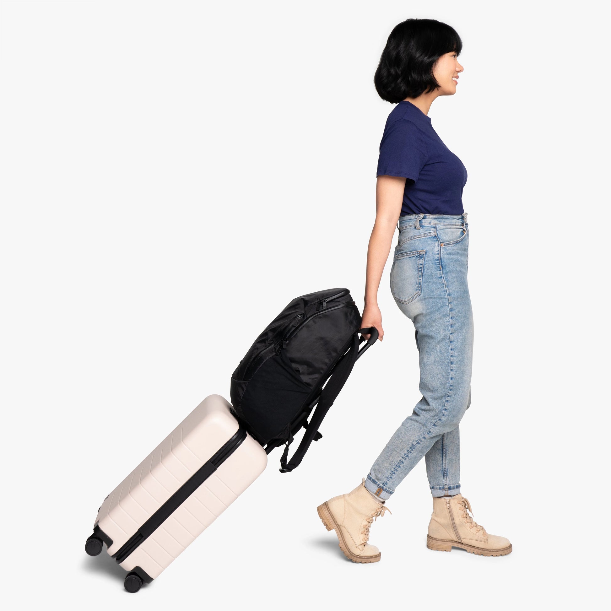 Luggage handle pass-through sleeve for upright, hands-free carry on a suitcase