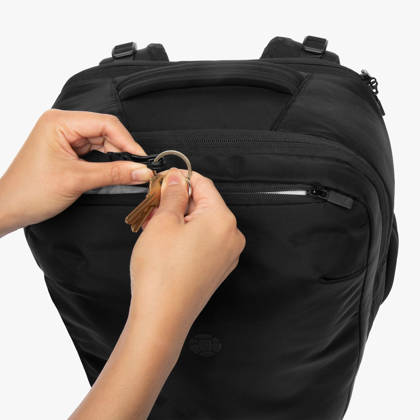 Quick access top pocket with key clip