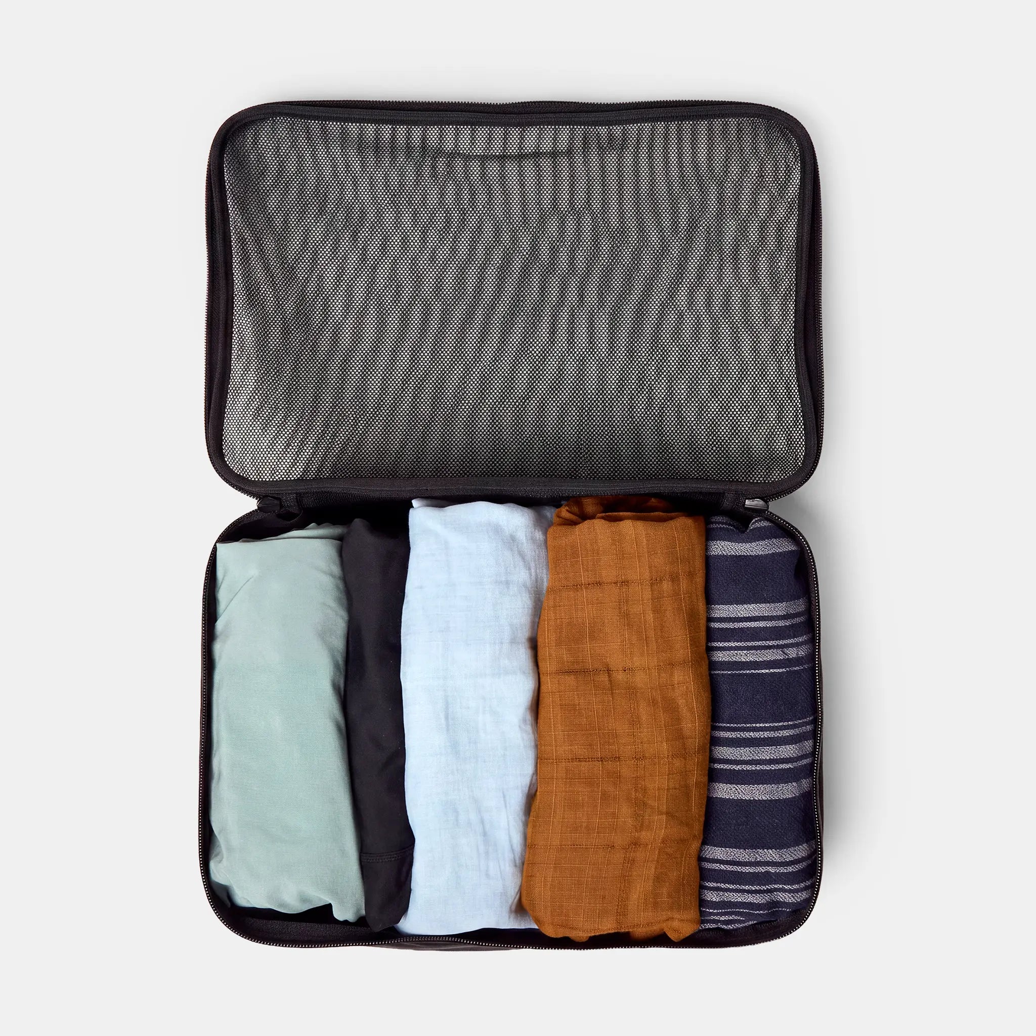 Pack shirts and pants in the large cube