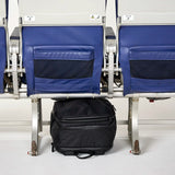 Personal item that fits under the seat in front of you