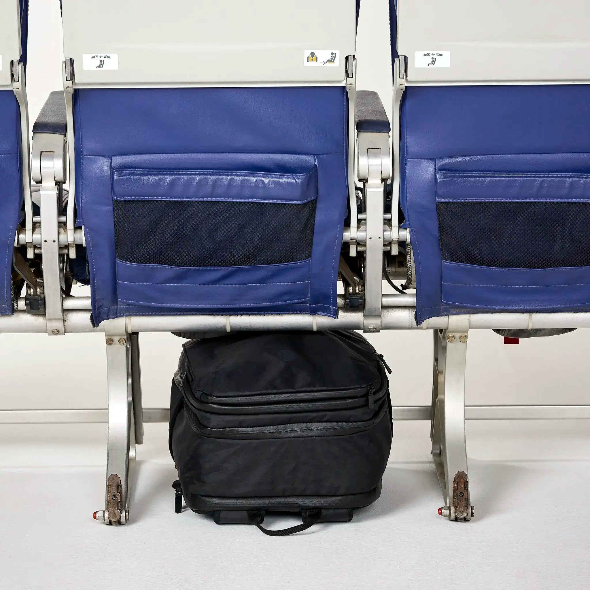 Personal item that fits under the seat in front of you